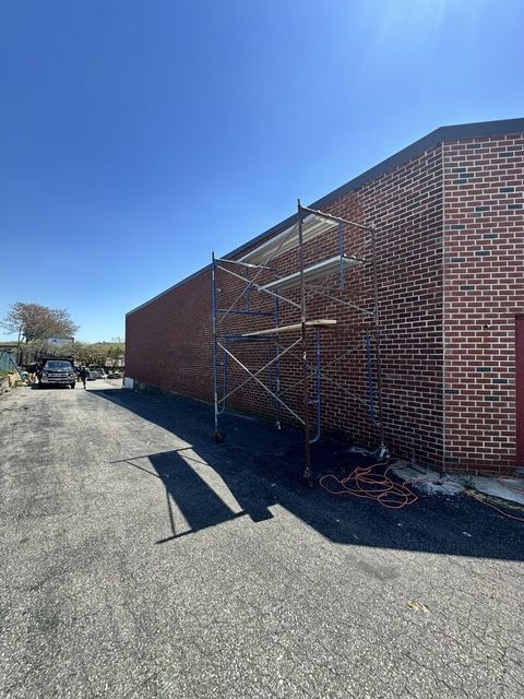 Commercial masonry and lintel restoration at a warehouse