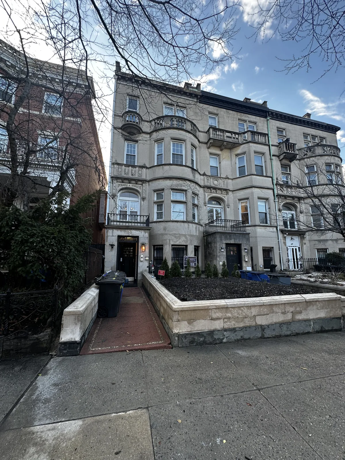 Multifamily building exterior after power-washing and maintenance work