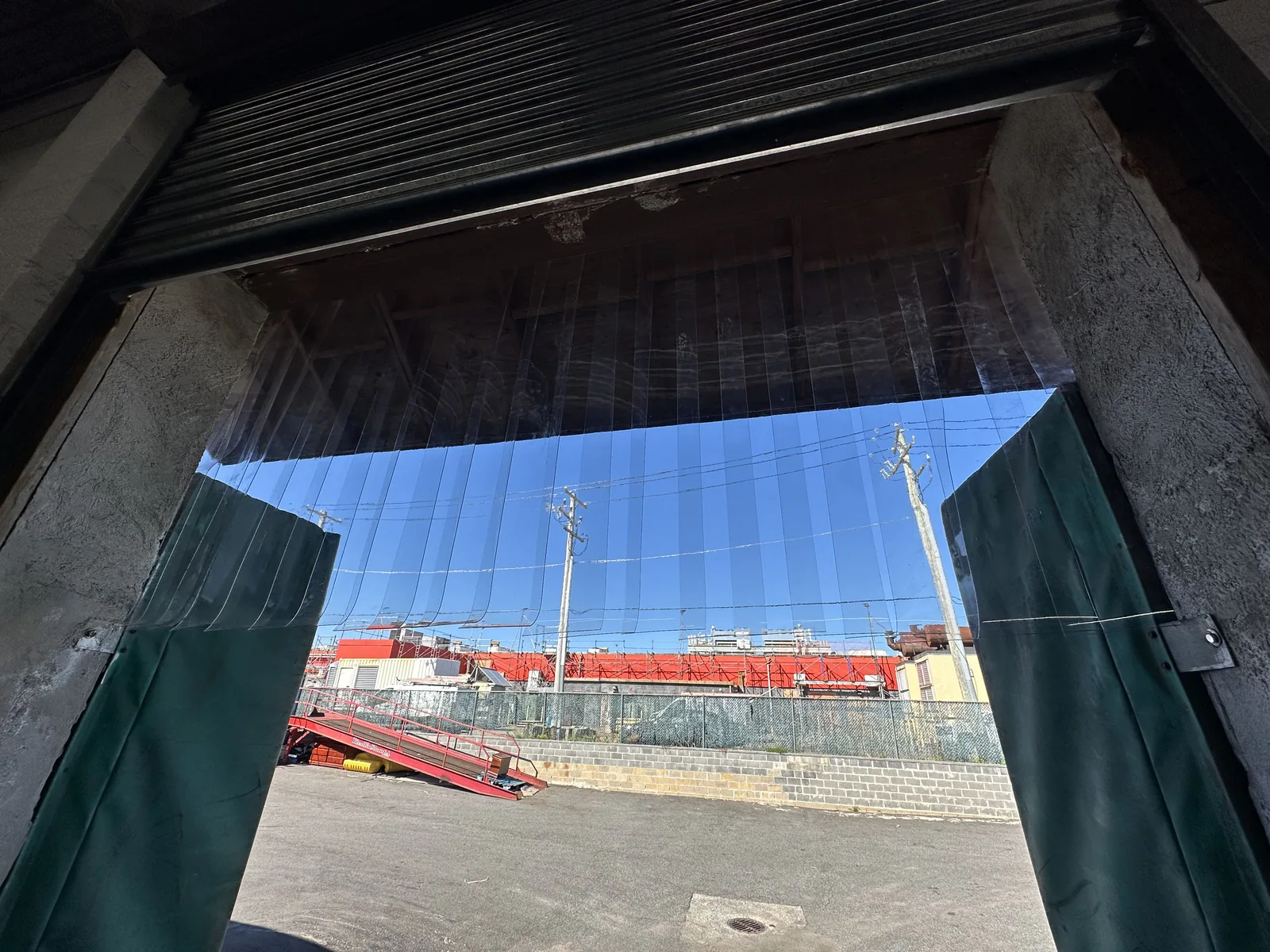 Commercial loading dock opening after repair and bird-deterrent work
