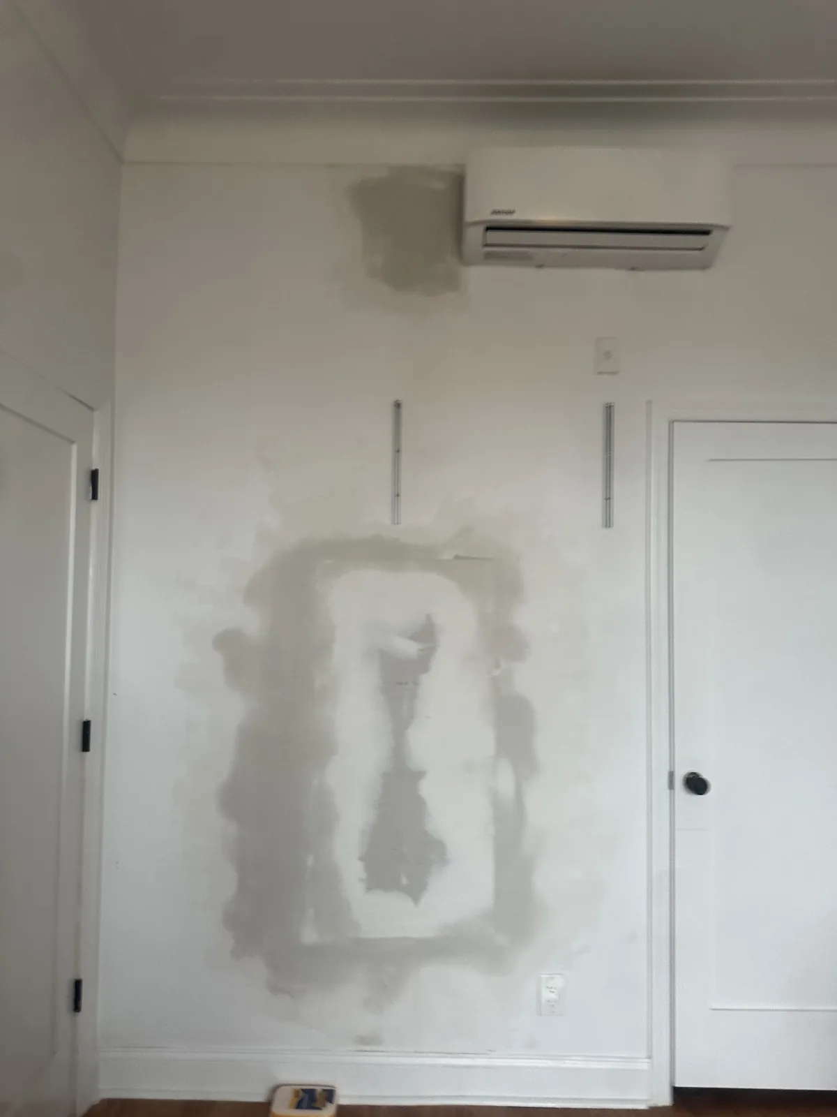 Drywall repair and finishing work inside a multifamily property