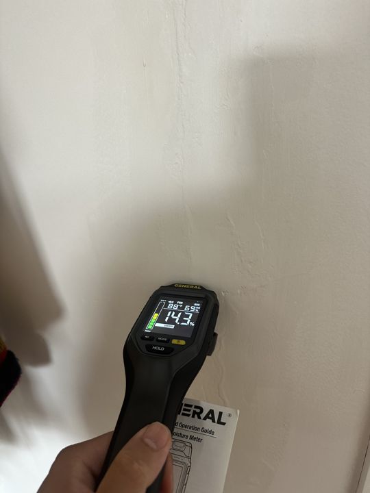 Moisture reading at a marked ceiling point.
