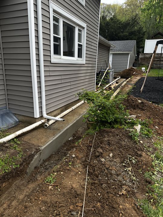 Drain line near the slab before backfill.