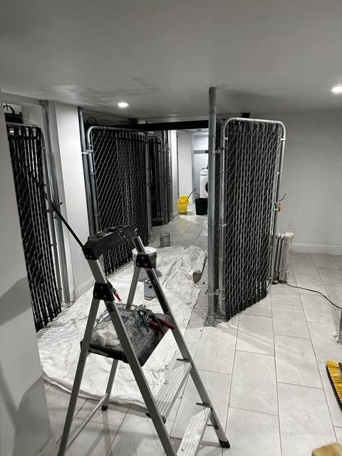 Completed tenant storage enclosures in a multifamily building