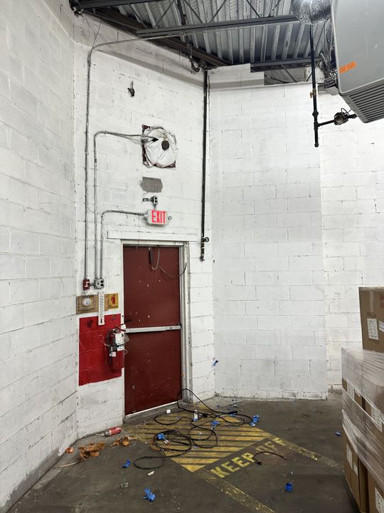 Exit door area cleaned up after the work.
